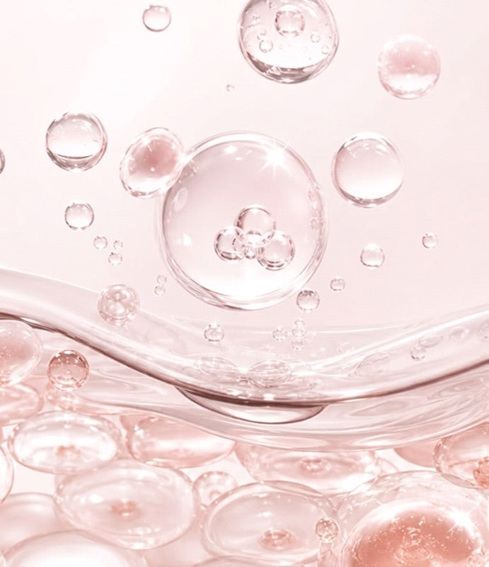 Pink hydrating serum droplets — GlowBiome Glutathione Hydration Serum texture